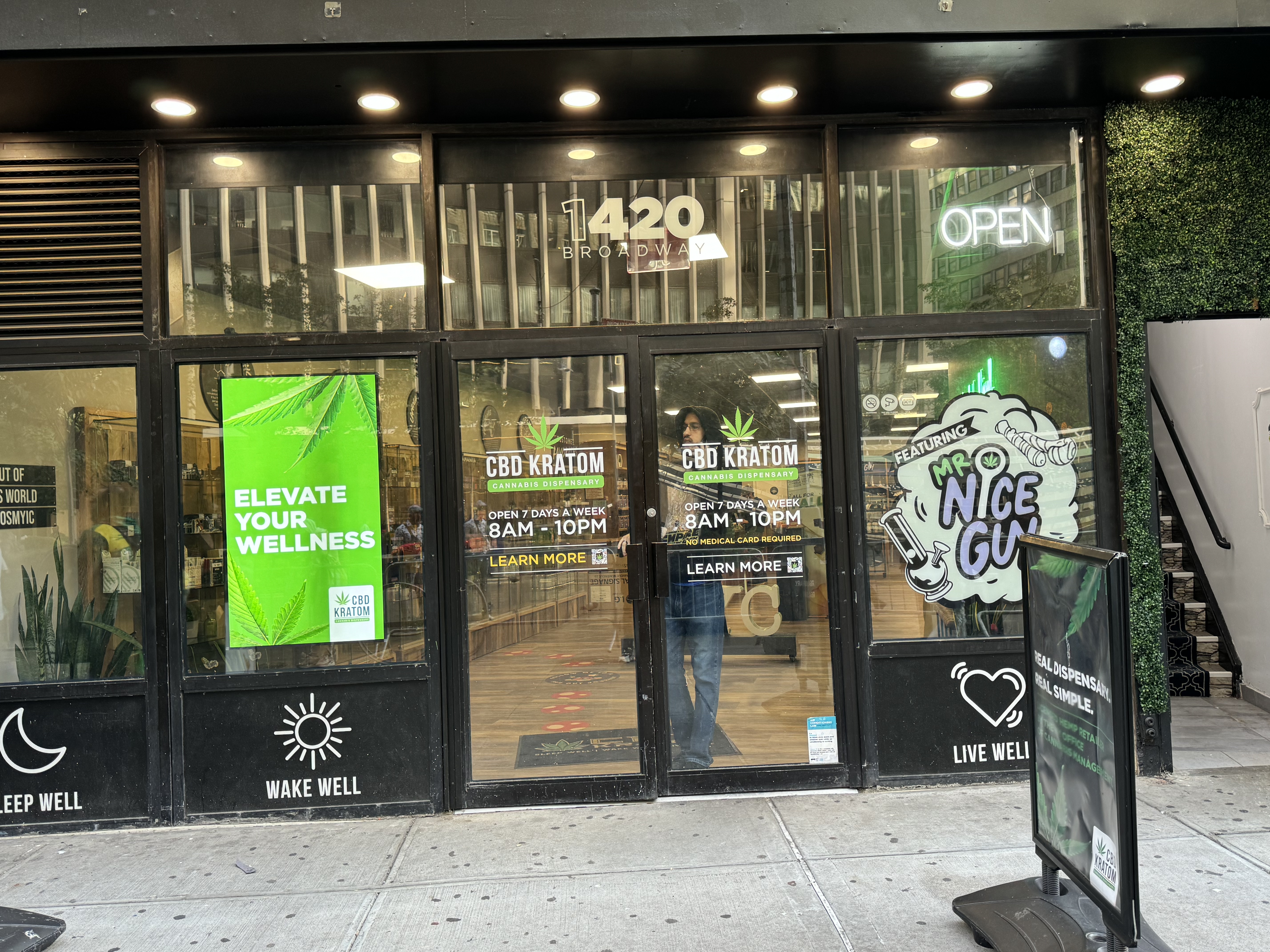 CBD Kratom storefront — Samsung sun-readable 55-inch window display
